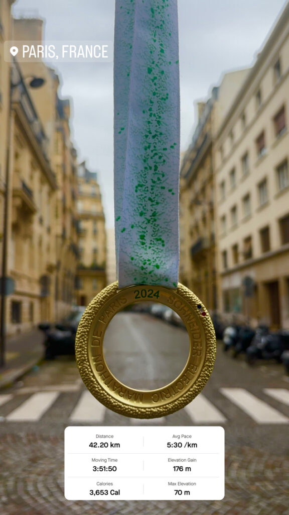 Lucy Wilson's Paris Marathon medal with time. 