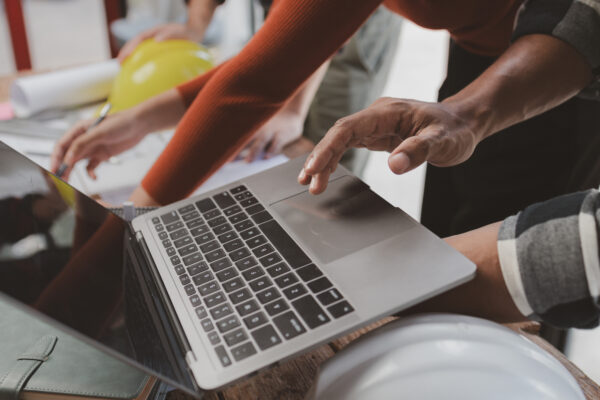 Design team members looking at a laptop