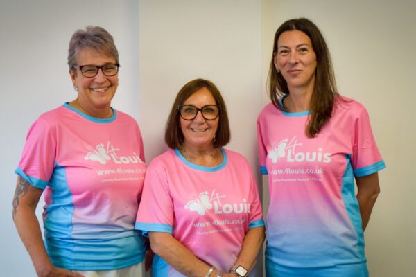 Members of Allied Protek staff wearing 4Louis charity t-shirts ahead of their skydive.