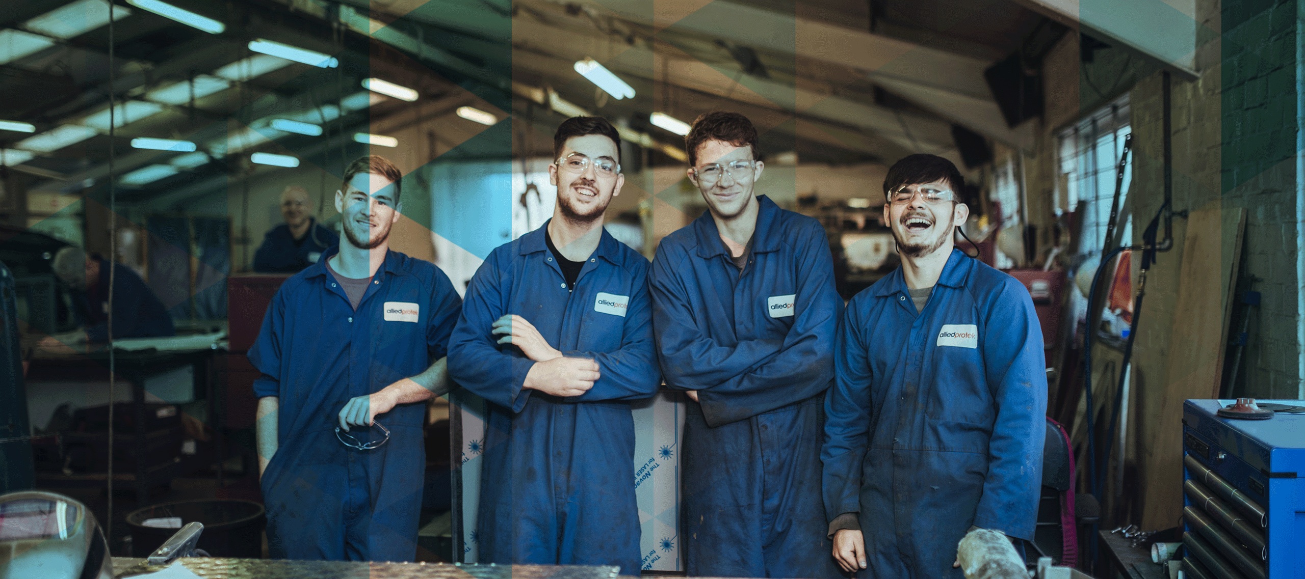 Four Allied Protek career apprentices posing and showing joy.